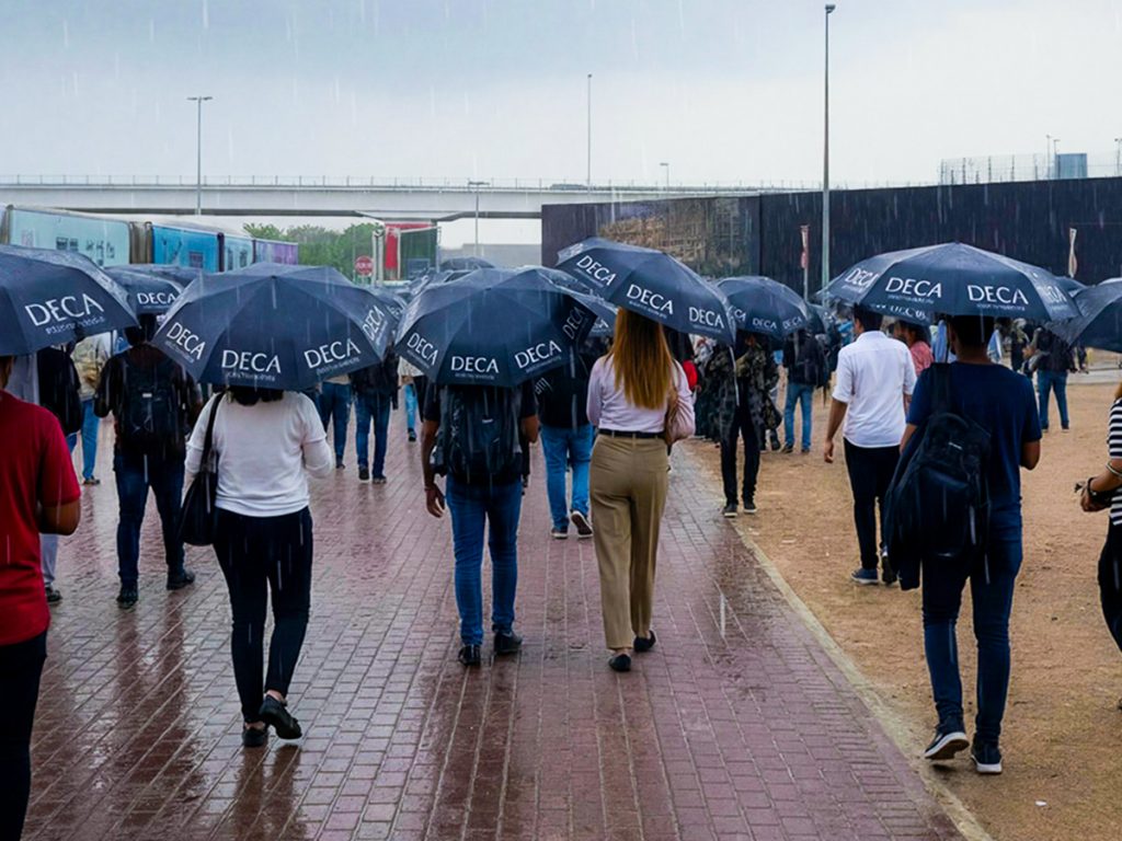 *DECA Staff Hand Out Umbrellas as Rain Hits Dubai*
